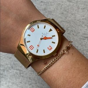 TOYWATCH gold watch with white facing